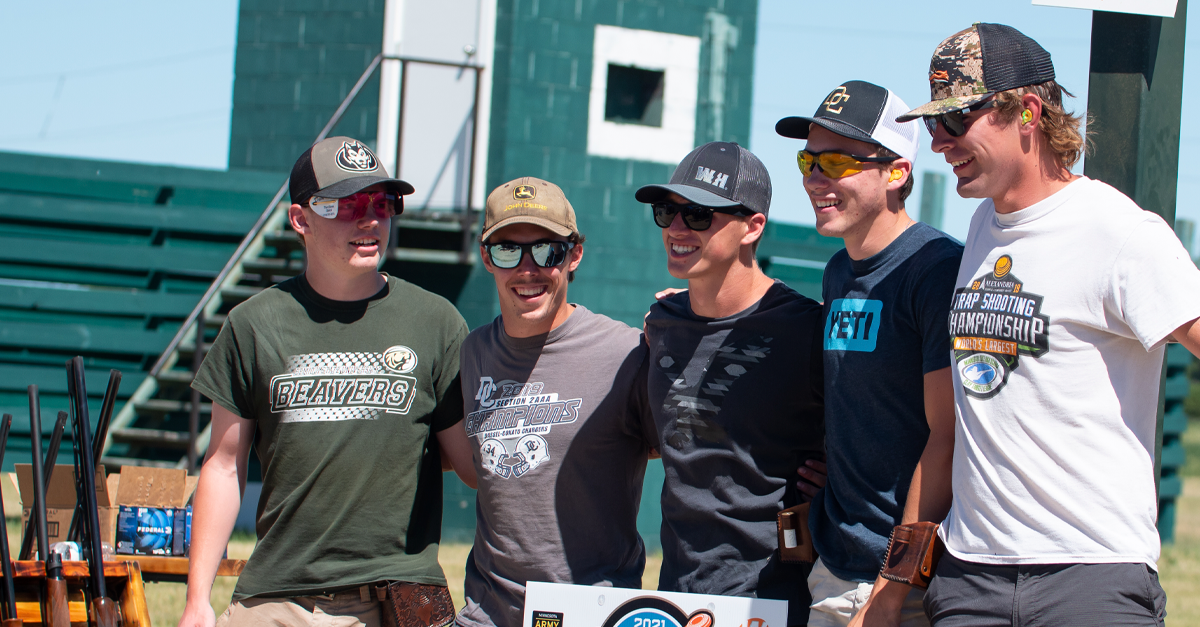 A group of men are posing for a picture.